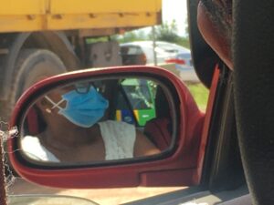 Lady wearing Mask in Public Transportation in Linden, Guyana (Gtmemoirs/Damien Lewis Image)