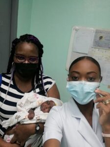 A NICU Nurse with Baby Miracle and her Mother Mrs. Fiona Jones