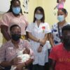 A NICU Nurse with Baby Miracle and her Mother Mrs. Fiona Jones