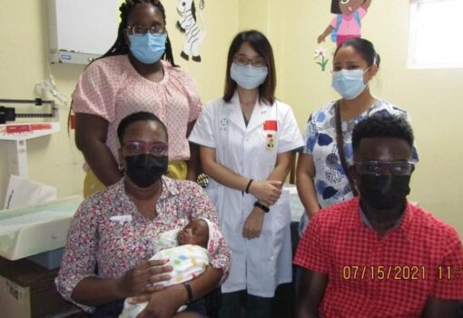 A NICU Nurse with Baby Miracle and her Mother Mrs. Fiona Jones