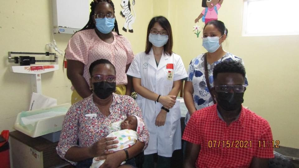 A NICU Nurse with Baby Miracle and her Mother Mrs. Fiona Jones