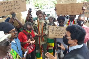 The group of Rastafarians and Attorney General Anil Nandlall exchange views about penalties for the possession of marijuana.